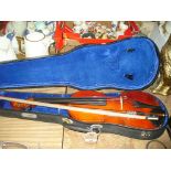 A Cased students violin.