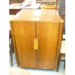 A Mid 20th Century walnut two door cabinet.