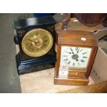 A Victorian black slate mantel clock with a gilt metal dial ,