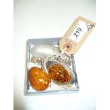A collection of silver jewellery, to include; a pressed amber brooch, a pressed amber pendant,