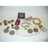 A 9ct Gold bangle with a metal core, ladies wristwatch, commemorative coins, defence medal,