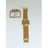 Rotary: A gold tone calendar bracelet strap wristwatch, With a shaped square face,