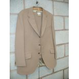 A Gents beige suit, 36" waist, 40" chest , 29" leg.