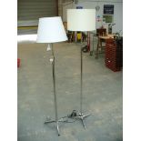 A Chromed adjustable tripod lamp standard and a second similar lamp.