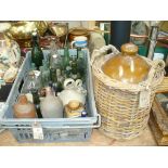 A Collection of old glass and stone ware bottles and a stoneware flagon.