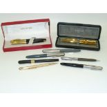 10 Assorted fountain and ball point pens including cased Parker pen sets.