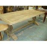 A Rustic pine plank top refectory table raised on two substantial baluster supports.