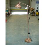 A Copper effect adjustable lamp standard.