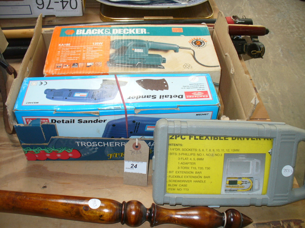 A Boxed Challenge electric sander, a flexible driver set and a boxed B & D electric sander.