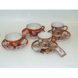 A pair of Chinese landscape cups and saucers and 2 similar cups and saucers.