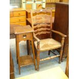 An Oak ladder back rush seated chair and an oak plant stand.