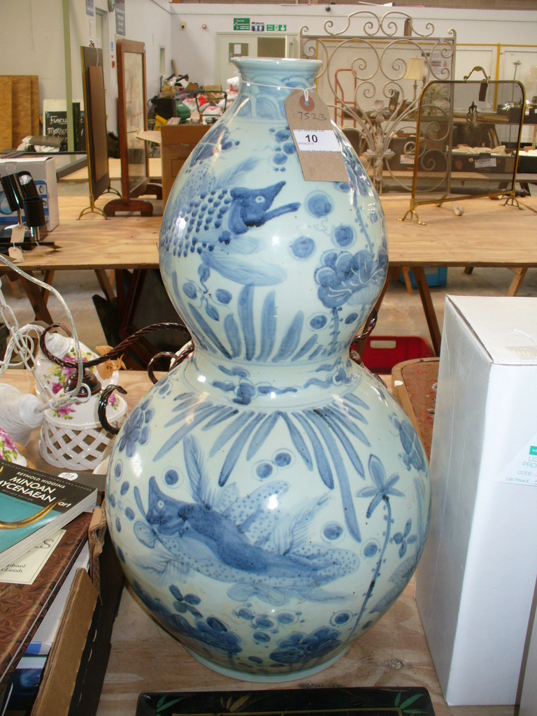 A Chinese double gourd Kang xi style blue and white vase.