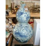 A Chinese double gourd Kang xi style blue and white vase.