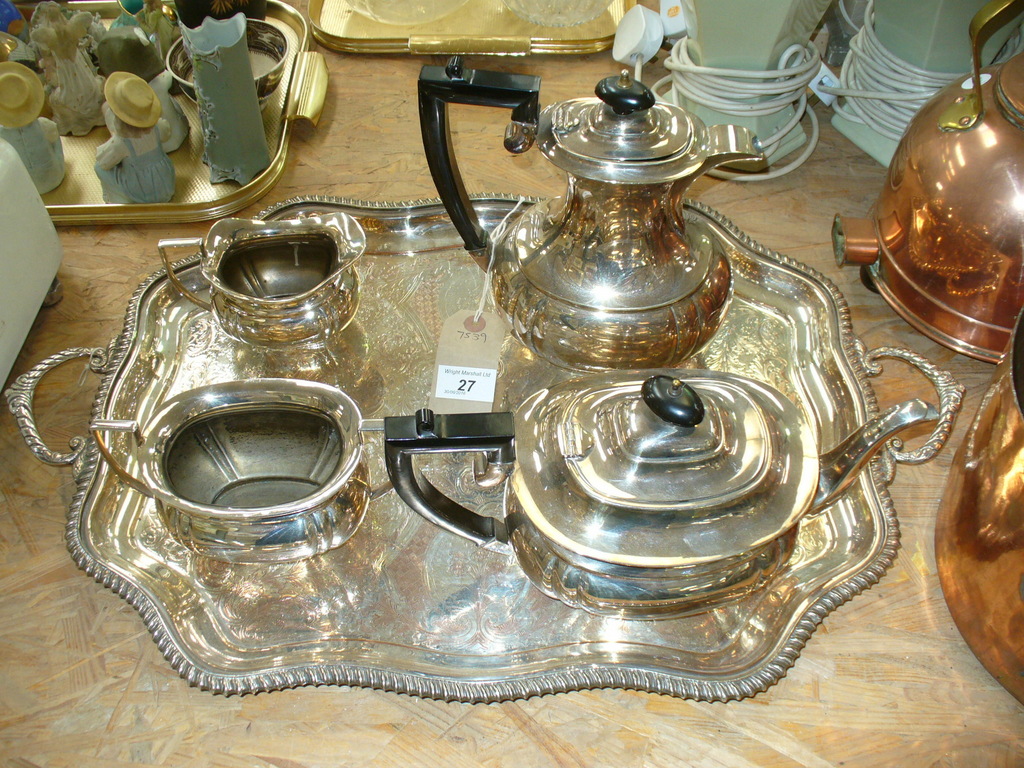 A Four piece silver plated panelled tea set and a silver plated two handled tray with a gadroon