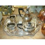 A Four piece silver plated panelled tea set and a silver plated two handled tray with a gadroon