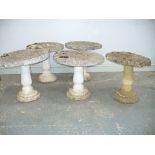 A collection of five reconstituted stone pedestal plinths Each of the stepped spreading circular