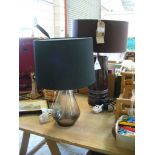 A Cylindrical ceramic table lamp and a glass bottle shaped table lamp c/w shades (2)