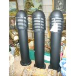 A Pair of black cylindrical outdoor column lamps.