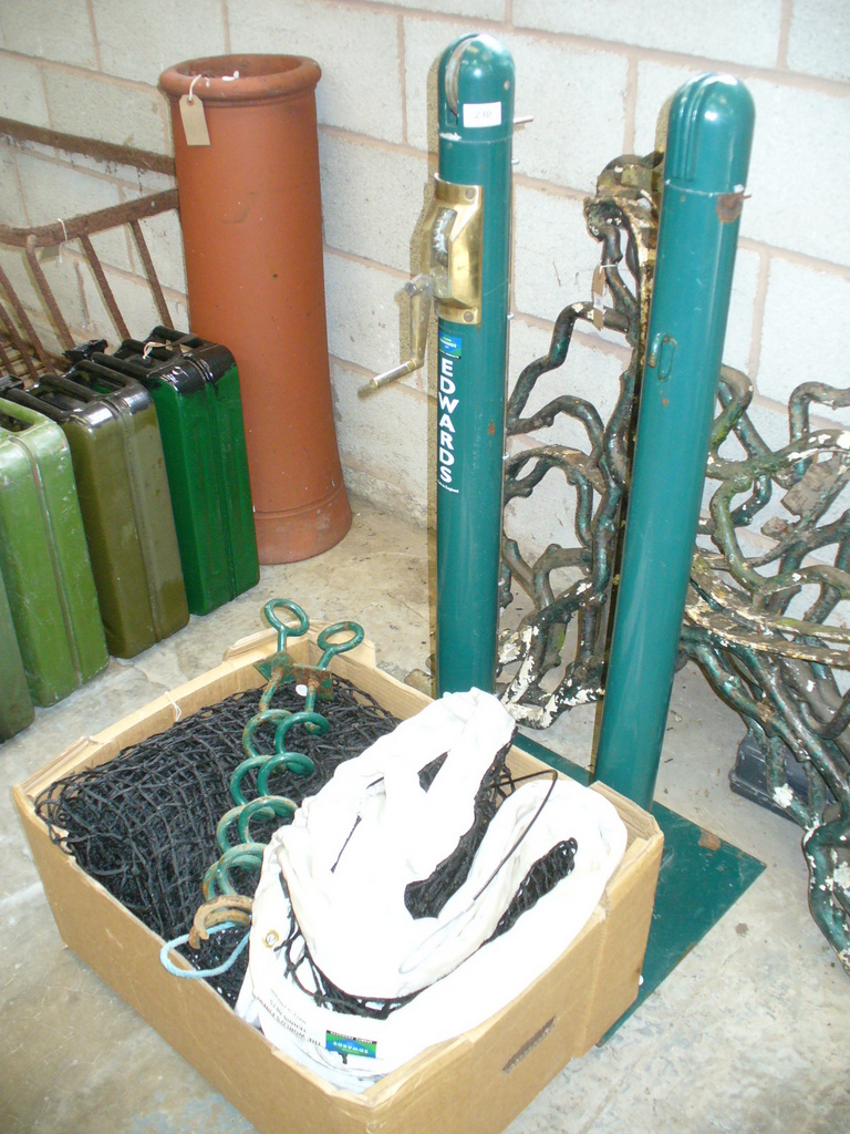 A Set of Edwards tennis posts with a brass winder and complete with bases and a new Edwards tennis