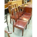 A Set of six Chinese rosewood dining chairs with open work splat backs.