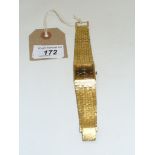 Rotary: A gold tone bracelet strap wristwatch, the square face, set with imitation cat's eye,