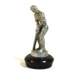 A vintage silver-plated car mascot Modelled in the form of a cricketer, raised on domed support,