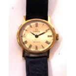 An Omega De Ville ladies wristwatch Mounted on a black leather strap,