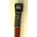 A 20th century walk stick With a pewter dogs head finial,