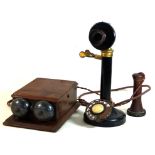 An early 20th century candlestick telephone Height 32cm, together with one switching box,