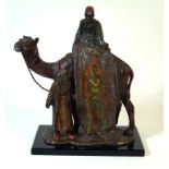 A late 19th/early 20th century cold painted spelter figure group Modelled in the form of arab