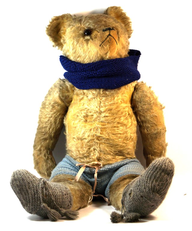 A good quality large gold plush teddy bear With pointed snout,