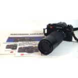 A Leica R3 electronic camera in black finish With Leitz Wetzlar f 200mm lens, serial number 1478664,