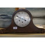 An early 20th Century oak cased Napoleon's hat mantel clock, bears presentation plaque.