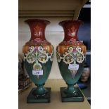 A pair of Royal Bonn vases each having Art Nouveau decoration on a multi coloured ground.