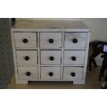 A contemporary bone nine drawer jewellery casket Of rectangular form, raised on four bracket feet,