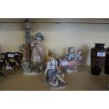 Three assorted Lladro figures to include children seated in model aeroplane,