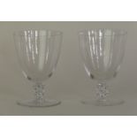 A pair of Rene Lalique wine glasses Each with large funnel shaped bowls,