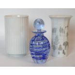 A Caithness Scottish glass perfume bottle and stopper Having internal linear decoration,