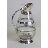 An Arts & Crafts style silver-plated and clear glass jug Modelled in the form of a barrel with