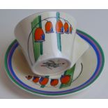 A Clarice Cliff Bizarre conical cup and saucer Decorated in the 'Solomon's Seal' pattern,