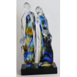 A contemporary Vetro Artistico Murano glass figure group Modelled in the form of a multi-coloured