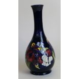 A Walter Moorcroft pottery vase of baluster form with cylindrical neck Decorated in the Orchid