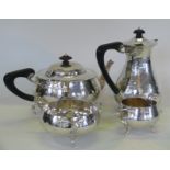 A George V hallmarked silver four piece tea service Comprising hot water pot, teapot,