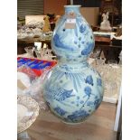 A Chinese double gourd Kang xi style blue and white vase.