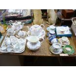 A Roslyn 'Moss Rose' floral pattern tea service, a Paragon 'Country Lane' teapot and dinner plates,