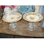 A Pair of 19th Century porcelaineous comport table centres each with an openwork dish supported on