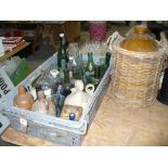 A Collection of old glass and stone ware bottles and a stoneware flagon.