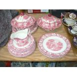 A quantity of Woods 'Colonial' red and white table wares including two tureens with leafy fruit