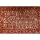 A Kayam prayer rug on a red ground, 20th