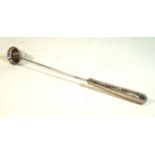 A sterling silver candle snuffer